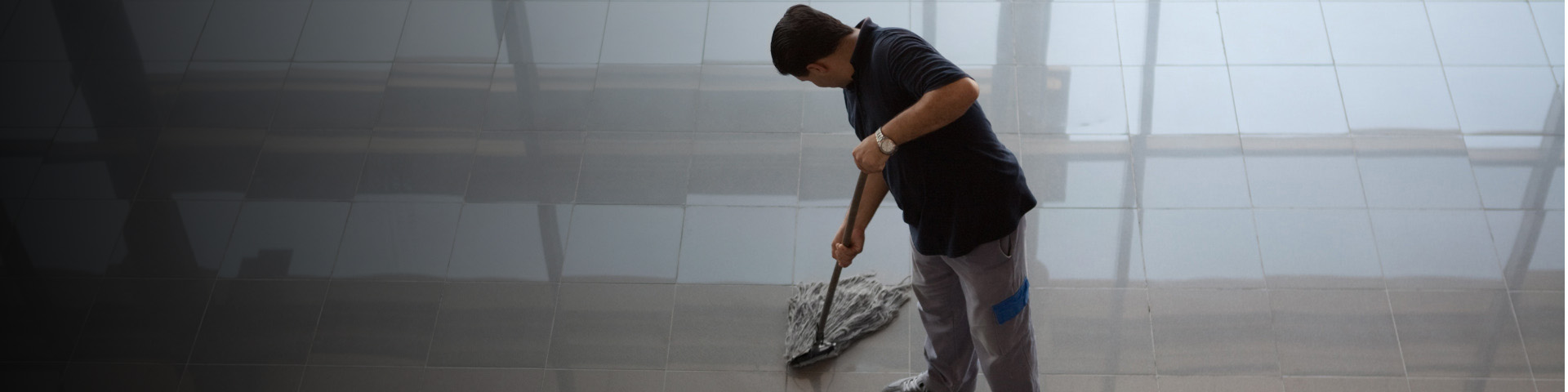 Man mopping the floor